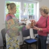 Sheila presenting Lucy with the Best of Arts and Crafts Cup for her wooden "Pig in a Pen"