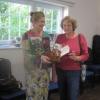 Sheila presenting Lucy with the Best of Arts and Crafts Cup for her wooden "Pig in a Pen"