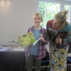 Hazel receiving her cup for the Best Children's hand-made card