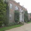Across the front showing the portico