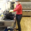Stella in the kitchen cleaning the barbecue
