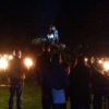 The guy is being placed on top of the bonfire