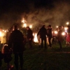 Even more torches are thrown onto the bonfire