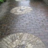 The Normandy stone millstones set into the terrace