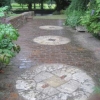 The Normandy stone millstones set into the terrace