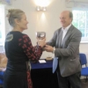Sheila Sorby receiving the Polly Chiverton Cup from Judge Ray for the Finest Floral Arrangement - her Blue Theme