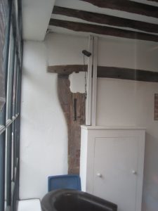 The shop in Market Street showing the original jetted timber of the shop front